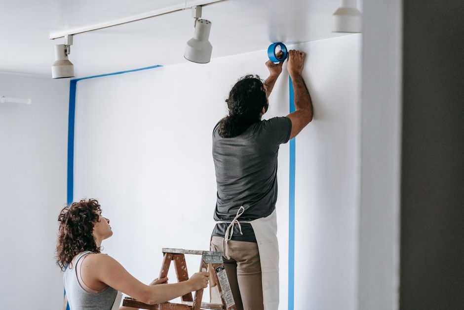Painting crew at work on the outside of a house